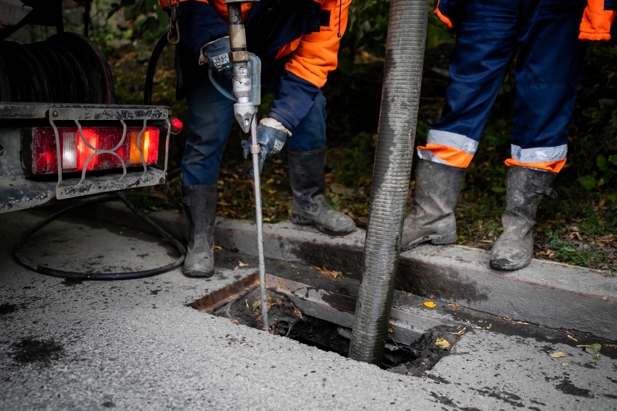 Cleaning storm drains from debris, clogged drainage systems are cleaned with a pump and water