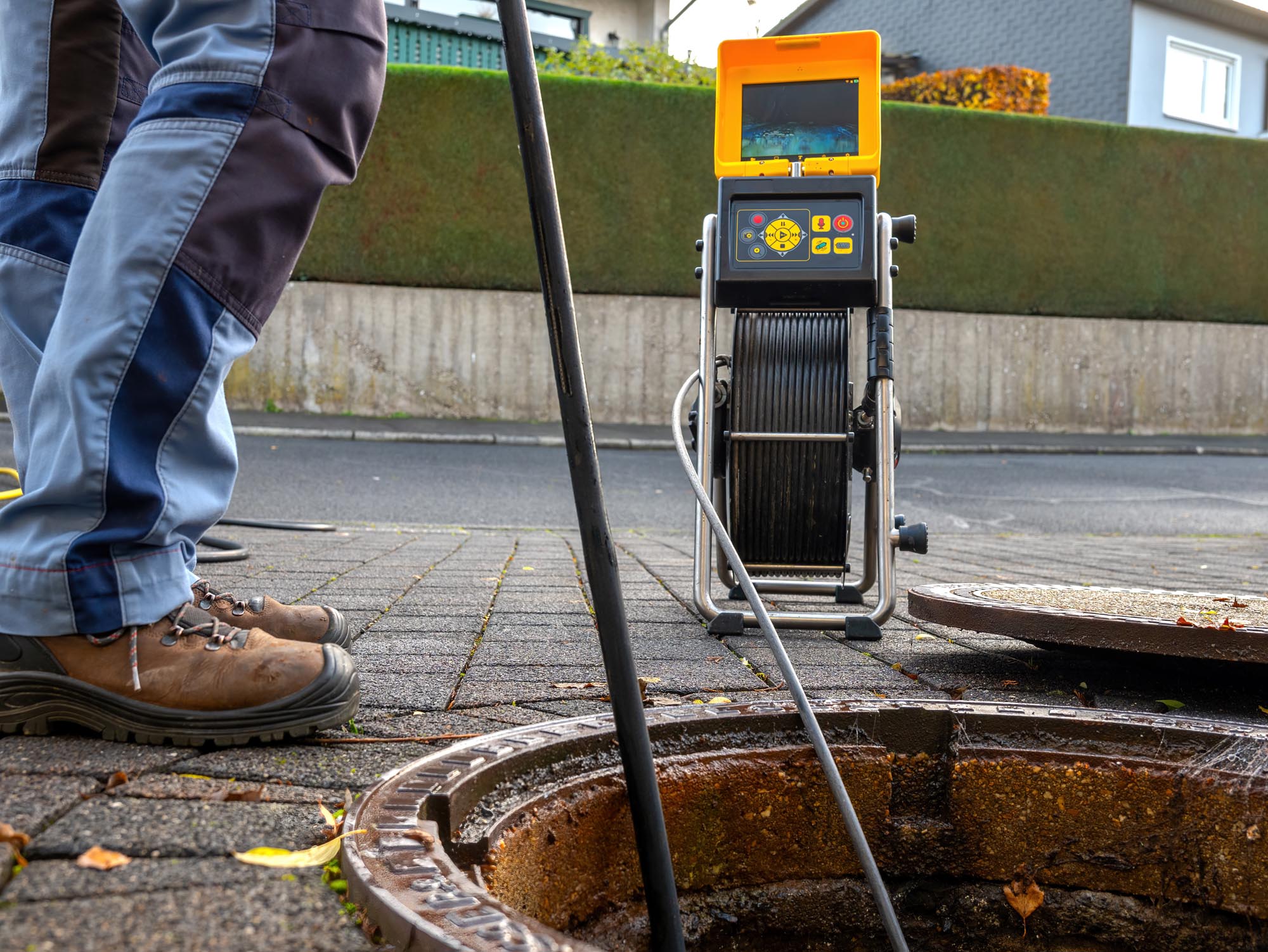 A drain cleaning company checks a blocked drain with a camera